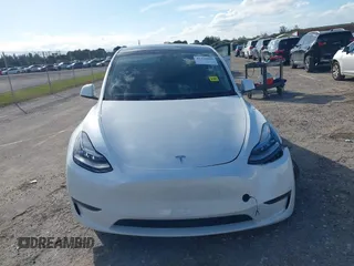 2023 Tesla Model Y Long Range z VIN 7SAYGDEE0PA128888, wystawiony jako IAAI lot #41410085 z przebiegiem 12 578 mil mil oraz . Historia ofert i sprzedaży dostępna na DreamBid. Obrazek 12.