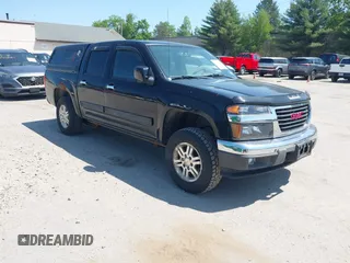 2012 GMC Canyon SLE1 z VIN 1GTH6MFE6C8140488, wystawiony jako IAAI lot #42399125 z przebiegiem 92 729 mil mil oraz . Historia ofert i sprzedaży dostępna na DreamBid. Obrazek 1.