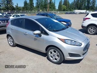 2016 Ford Fiesta SE z VIN 3FADP4EJ0GM122392, wystawiony jako IAAI lot #42364419 z przebiegiem 98 357 mil mil oraz . Historia ofert i sprzedaży dostępna na DreamBid. Obrazek 1.