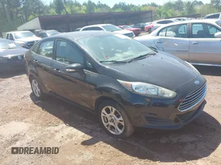 2015 Ford Fiesta SE with VIN 3FADP4BJ9FM113645, listed as a IAAI auction lot 41970671 with 138,026 mi miles. Bid and sale history available at carsss.com. Image 1.