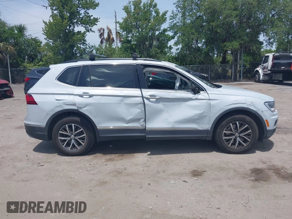 2018 Volkswagen Tiguan SEL with VIN 3VV3B7AX4JM201878, listed as a IAAI auction lot 42083809 with 115,956 mi miles and . Bid and sale history available at DreamBid. Image 14.