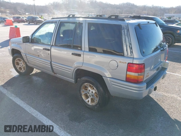 1997 Jeep Grand Cherokee Limited with VIN 1J4GZ78Y8VC718435, listed as a IAAI auction lot 41405361 with 210,599 mi miles. Bid and sale history available at carsss.com. Image 3.