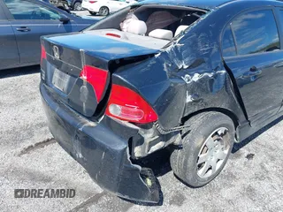 2007 Honda Civic Sdn LX with VIN 1HGFA16577L134935, listed as a IAAI auction lot 41975087 with 255,338 mi miles. Bid and sale history available at carsss.com. Image 6.