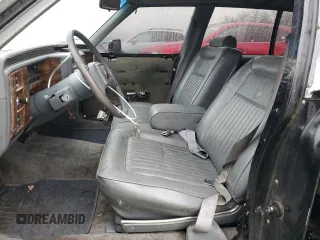 1989 Cadillac Brougham z VIN 1G6DW51Y9KR725809, wystawiony jako Copart lot #80902764 z przebiegiem 56 033 mil mil oraz Szkody całkowita. Historia ofert i sprzedaży dostępna na DreamBid. Obrazek 7.