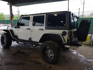 2012 Jeep Wrangler Unlimited Sport с VIN 1C4BJWDG8CL183831, выставлен на аукционе IAAI как лот 42343612 с пробегом 166 847 миль миль и . История ставок и продаж доступна на DreamBid. Изображение 3.