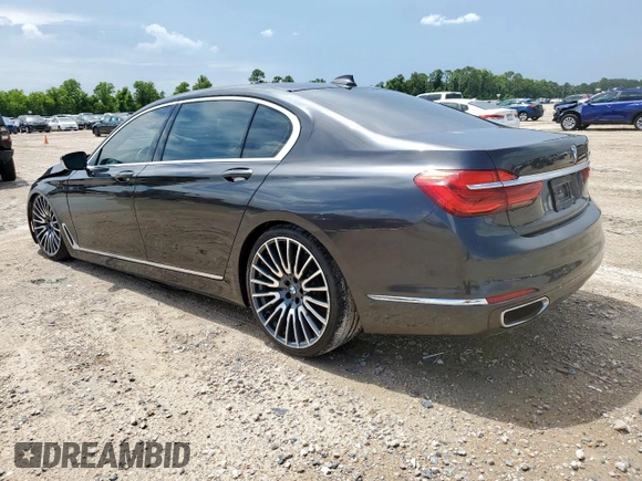 2016 BMW 7 Series 740i with VIN WBA7E2C57GG714564, listed as a Copart auction lot 64005965 with 111,598 mi miles and Salvage title. Bid and sale history available at DreamBid. Image 2.