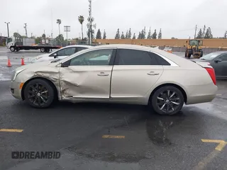2013 Cadillac XTS z VIN 2G61N5S32D9127146, wystawiony jako IAAI lot #41578528 z przebiegiem 98 529 mil mil oraz . Historia ofert i sprzedaży dostępna na DreamBid. Obrazek 14.