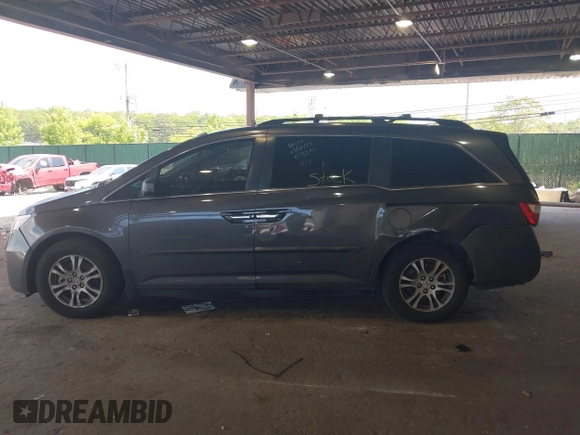 2012 Honda Odyssey EX-L with VIN 5FNRL5H67CB016934, listed as a IAAI auction lot 42405714 with 248,512 mi miles and . Bid and sale history available at DreamBid. Image 14.