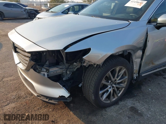 2017 Mazda CX-9 Grand Touring with VIN JM3TCADY5H0138176, listed as a IAAI auction lot 41458610 with 114,664 mi miles and . Bid and sale history available at DreamBid. Image 6.