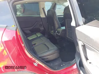 2023 Tesla Model Y Long Range z VIN 7SAYGAEE7PF691499, wystawiony jako IAAI lot #42038850 z przebiegiem 26 439 mil mil oraz . Historia ofert i sprzedaży dostępna na DreamBid. Obrazek 8.