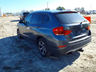 2014 BMW X1 sDrive28i with VIN WBAVM1C51EVW49093, listed as a IAAI auction lot 41500647 with 111,036 mi miles. Bid and sale history available at carsss.com. Image 3.