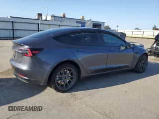 2023 Tesla Model 3 with VIN 5YJ3E1EA9PF714646, listed as a Copart auction lot 51551455 with 29,611 mi miles and Salvage Title. Bid and sale history available at DreamBid. Image 3.