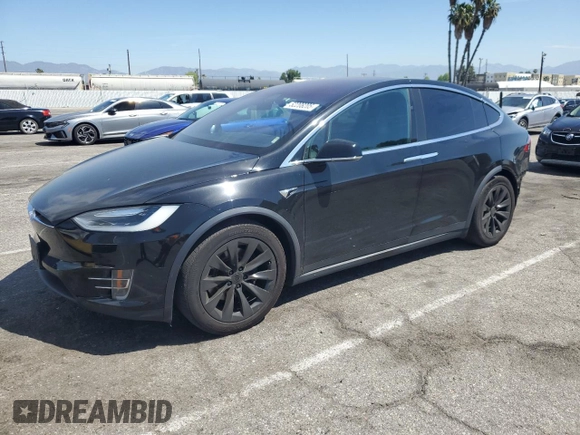 2017 Tesla Model X 90D with VIN 5YJXCBE20HF051099, listed as a Copart auction lot 52208205 with 118,828 mi miles and Salvage Title. Bid and sale history available at DreamBid. Image 1.