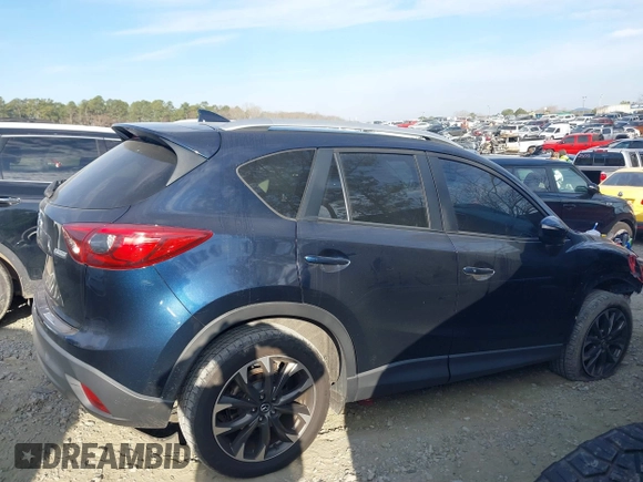 2016 Mazda CX-5 Grand Touring with VIN JM3KE2DY1G0708572, listed as a IAAI auction lot 41685298 with 109,427 mi miles. Bid and sale history available at carsss.com. Image 13.