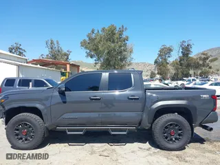 2024 Toyota Tacoma 4WD SR5 with VIN 3TMLB5JN4RM039036, listed as a IAAI auction lot 41813562 with 2,112 mi miles. Bid and sale history available at carsss.com. Image 15.