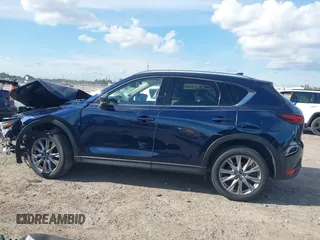 2021 Mazda CX-5 Grand Touring with VIN JM3KFADM0M0469886, listed as a IAAI auction lot 41617270 with 33,571 mi miles. Bid and sale history available at carsss.com. Image 15.