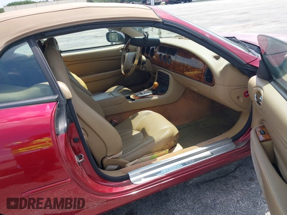 1997 Jaguar XK with VIN SAJGX2743VC017588, listed as a IAAI auction lot 42055716 with 66,052 mi miles and . Bid and sale history available at DreamBid. Image 5.