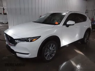 2021 Mazda CX-5 Grand Touring with VIN JM3KFADM3M0312143, listed as a IAAI auction lot 41606582 with 46,515 mi miles. Bid and sale history available at carsss.com. Image 2.