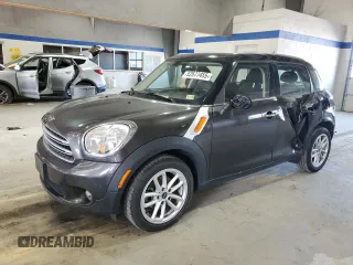 2016 MINI Countryman with VIN WMWZB3C54GWR49713, listed as a Copart auction lot 52577455 with 84,426 mi miles and Salvage title. Bid and sale history available at DreamBid. Image 1.