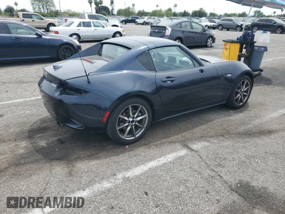2021 Mazda MX-5 Miata Grand Touring with VIN JM1NDAM70M0460532, listed as a Copart auction lot 58828045 with 70,269 mi miles and Salvage title. Bid and sale history available at DreamBid. Image 3.