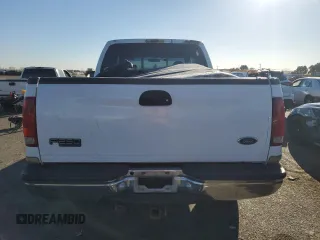2000 Ford Super Duty F-250 XL with VIN 1FTNW21S1YED65639, listed as a Copart auction lot 74377194 with 158,387 mi miles and Salvage Title. Bid and sale history available at carsss.com. Image 6.