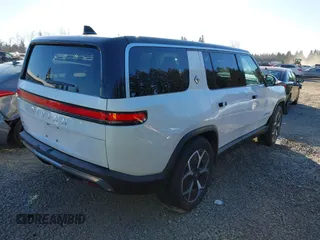 2024 Rivian R1S Adventure with VIN 7PDSGBBA9RN039684, listed as a IAAI auction lot 41558846 with 13,725 mi miles. Bid and sale history available at carsss.com. Image 4.