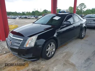 2009 Cadillac CTS RWD w/1SB with VIN 1G6DU57V290147277, listed as a IAAI auction lot 41995209 with 120,576 mi miles. Bid and sale history available at carsss.com. Image 2.