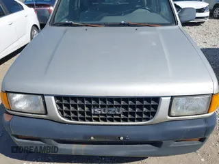1995 Isuzu Rodeo z VIN 4S2CM58V4S4363500, wystawiony jako IAAI lot #41821801 z przebiegiem 94 480 mil mil oraz . Historia ofert i sprzedaży dostępna na DreamBid. Obrazek 16.