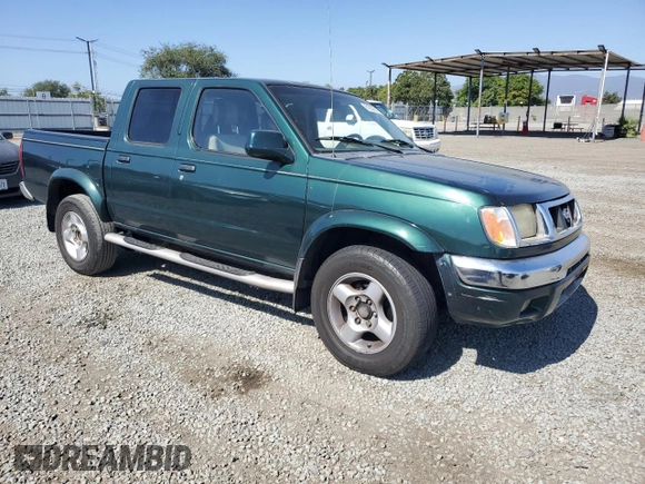 2000 Nissan Frontier XE with VIN 1N6ED27T0YC364061, listed as a Copart auction lot 61863515 with 226,867 mi miles and Clean title. Bid and sale history available at DreamBid. Image 4.
