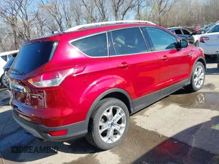 2014 Ford Escape Titanium with VIN 1FMCU9J97EUB79748, listed as a IAAI auction lot 41884915 with 197,899 mi miles. Bid and sale history available at carsss.com. Image 4.