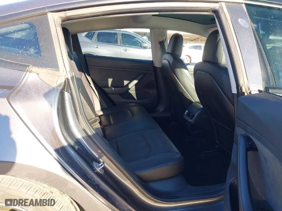 2018 Tesla Model 3 Long Range Battery with VIN 5YJ3E1EA8JF010834, listed as a IAAI auction lot 41598099 with 83,252 mi miles. Bid and sale history available at carsss.com. Image 8.