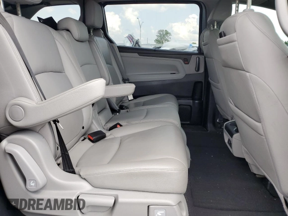 2021 Honda Odyssey Touring z VIN 5FNRL6H85MB039444, wystawiony jako Copart lot #57142205 z przebiegiem 74 228 mil mil oraz Szkoda całkowita • Salvage title. Historia ofert i sprzedaży dostępna na DreamBid. Obrazek 11.