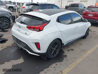2019 Hyundai Veloster Turbo with VIN KMHTH6AB3KU020193, listed as a IAAI auction lot 41526722 with 54,697 mi miles. Bid and sale history available at carsss.com. Image 4.