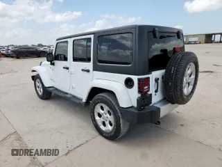 2014 Jeep Wrangler Unlimited Sahara with VIN 1C4BJWEG5EL309502, listed as a Copart auction lot 61804885 with 60,683 mi miles and Salvage title. Bid and sale history available at DreamBid. Image 2.