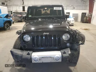 2015 Jeep Wrangler Unlimited Sahara with VIN 1C4BJWEG5FL611521, listed as a Copart auction lot 50609985 with 207,473 mi miles and Salvage Title. Bid and sale history available at carsss.com. Image 5.