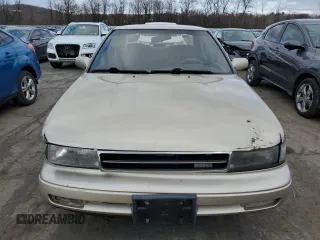 1990 Nissan Maxima z VIN JN1HJ01P8LT402950, wystawiony jako Copart lot #82714734 z przebiegiem 60 727 mil mil oraz Tytuł czysty. Historia ofert i sprzedaży dostępna na DreamBid. Obrazek 5.