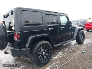 2011 Jeep Wrangler Unlimited Sahara with VIN 1J4BA5H12BL548870, listed as a IAAI auction lot 42010303 with 139,693 mi miles. Bid and sale history available at carsss.com. Image 6.