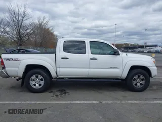 2015 Toyota Tacoma with VIN 5TFLU4EN6FX120947, listed as a IAAI auction lot 42043239 with 125,480 mi miles and . Bid and sale history available at DreamBid. Image 13.
