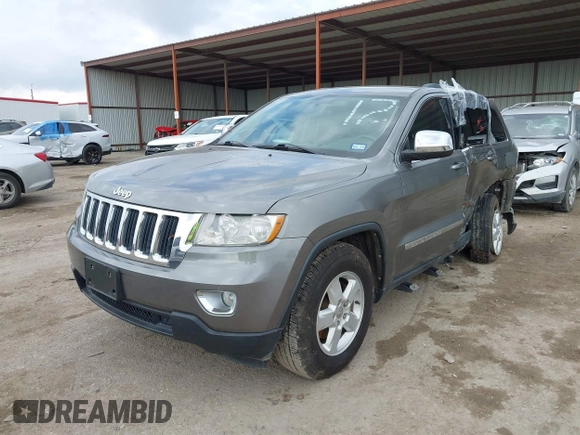 2013 Jeep Grand Cherokee Laredo with VIN 1C4RJEAG2DC571569, listed as a IAAI auction lot 41100518 with 98,265 mi miles. Bid and sale history available at carsss.com. Image 2.