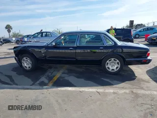 2003 Jaguar XJ 8 with VIN SAJDA14C03LF58706, listed as a IAAI auction lot 41619740 with 95,293 mi miles and . Bid and sale history available at DreamBid. Image 14.