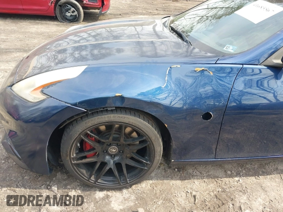 2014 Nissan 370Z Nismo z VIN JN1AZ4EH0EM631950, wystawiony jako IAAI lot #41685567 z przebiegiem 103 282 mil mil oraz . Historia ofert i sprzedaży dostępna na DreamBid. Obrazek 6.