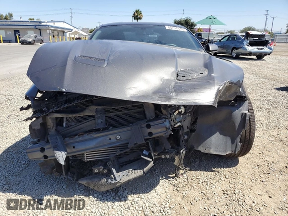 2020 Ford Mustang EcoBoost with VIN 1FA6P8TH5L5179011, listed as a Copart auction lot 63794115 with 34,735 mi miles and Salvage title. Bid and sale history available at DreamBid. Image 5.
