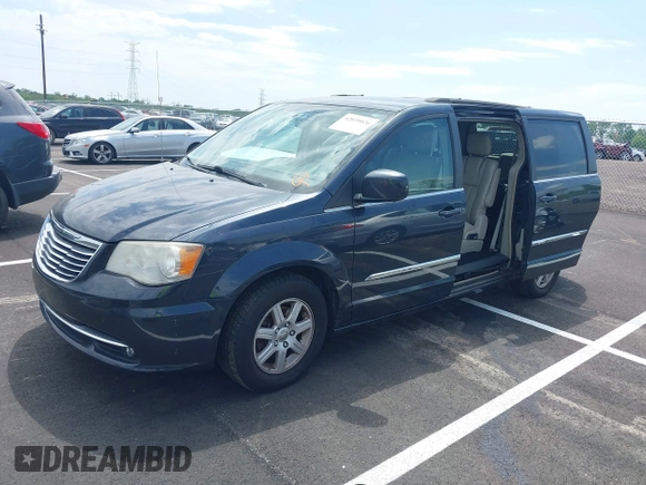 2013 Chrysler Town & Country Touring with VIN 2C4RC1BG8DR594671, listed as a IAAI auction lot 42039026 with 208,909 mi miles. Bid and sale history available at carsss.com. Image 2.