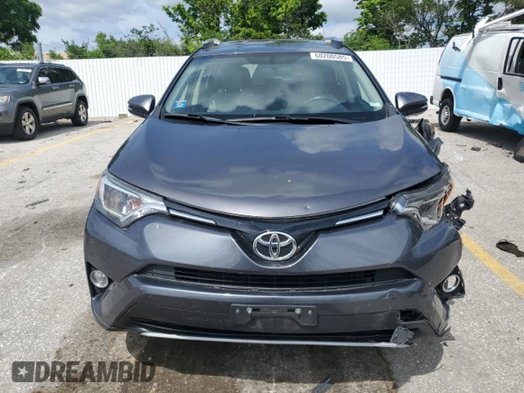2016 Toyota RAV4 XLE with VIN JTMRFREV6GJ099720, listed as a Copart auction lot 60200585 with 148,801 mi miles and Salvage title. Bid and sale history available at DreamBid. Image 5.