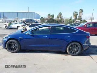 2018 Tesla Model 3 Long Range Battery with VIN 5YJ3E1EA4JF011799, listed as a IAAI auction lot 41765860 with 133,098 mi miles. Bid and sale history available at carsss.com. Image 14.