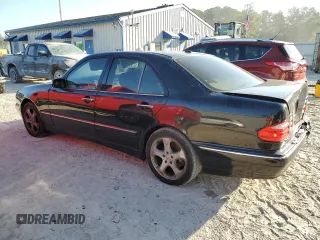 2002 Mercedes-Benz E-Class with VIN WDBJF65J32B494321, listed as a Copart auction lot 77557334 with 198,820 mi miles and Salvage Title. Bid and sale history available at carsss.com. Image 2.