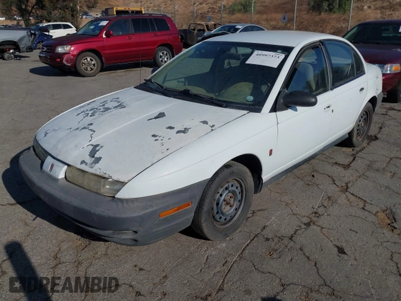 1998 Saturn SL z VIN 1G8ZG5283WZ233209, wystawiony jako IAAI lot #40997373 z przebiegiem 240 385 mil mil oraz . Historia ofert i sprzedaży dostępna na DreamBid. Obrazek 2.