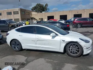 2020 Tesla Model 3 Long Range with VIN 5YJ3E1EB6LF619528, listed as a IAAI auction lot 41937430 with 70,327 mi miles. Bid and sale history available at carsss.com. Image 14.