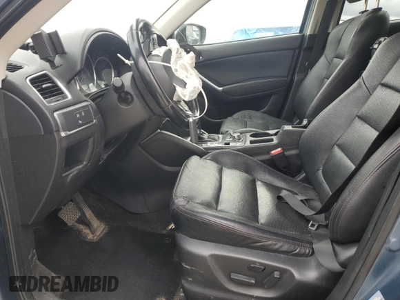 2016 Mazda CX-5 Grand Touring z VIN JM3KE4DY2G0637779, wystawiony jako Copart lot #52001805 z przebiegiem 184 381 mil mil oraz Czysty tytuł • Clean title. Historia ofert i sprzedaży dostępna na DreamBid. Obrazek 7.