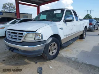 1999 Ford F-150 Work Series with VIN 1FTRX17W5XNB33627, listed as a IAAI auction lot 41933365 with 207,118 mi miles. Bid and sale history available at carsss.com. Image 2.